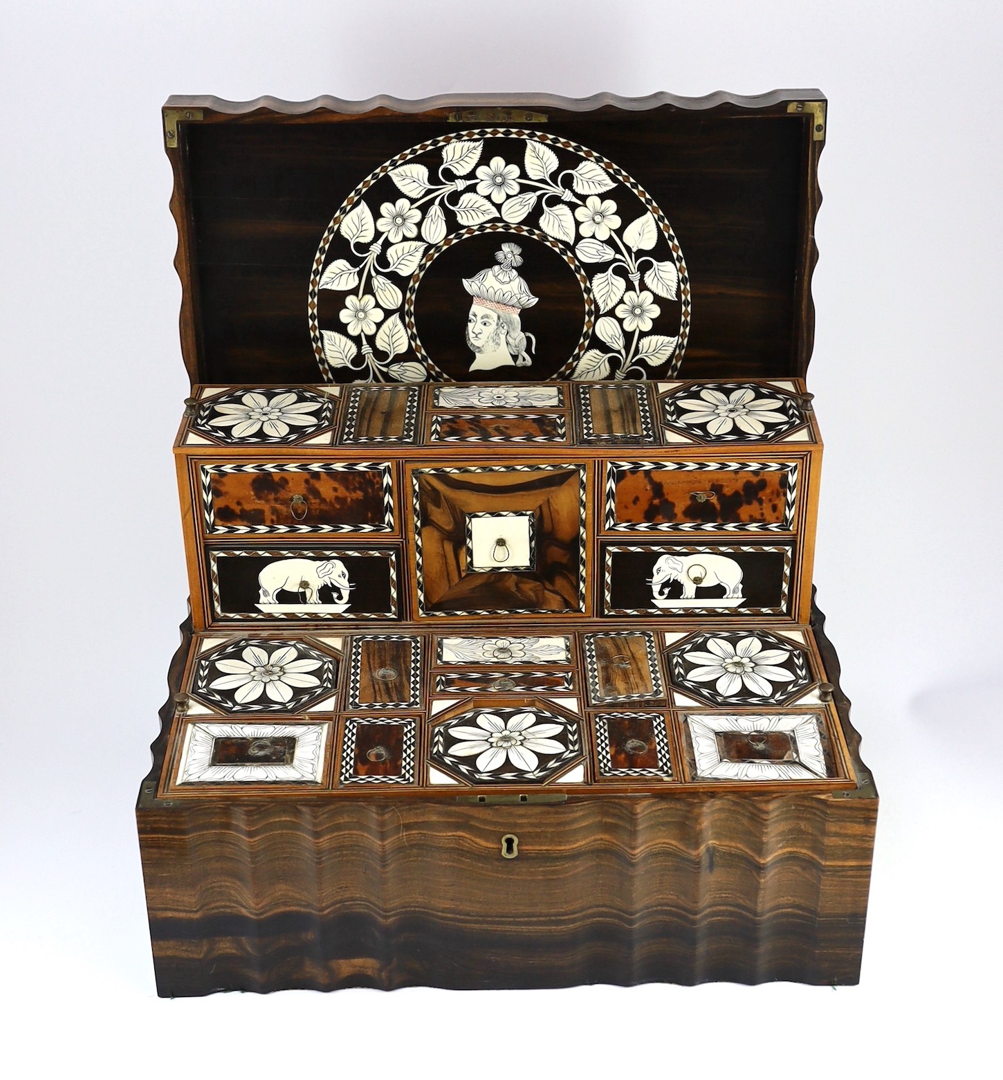 A mid 19th century Anglo Indian ivory inset ebony and other exotic hardwood travelling casket, 44cm wide 32cm deep 19cm high